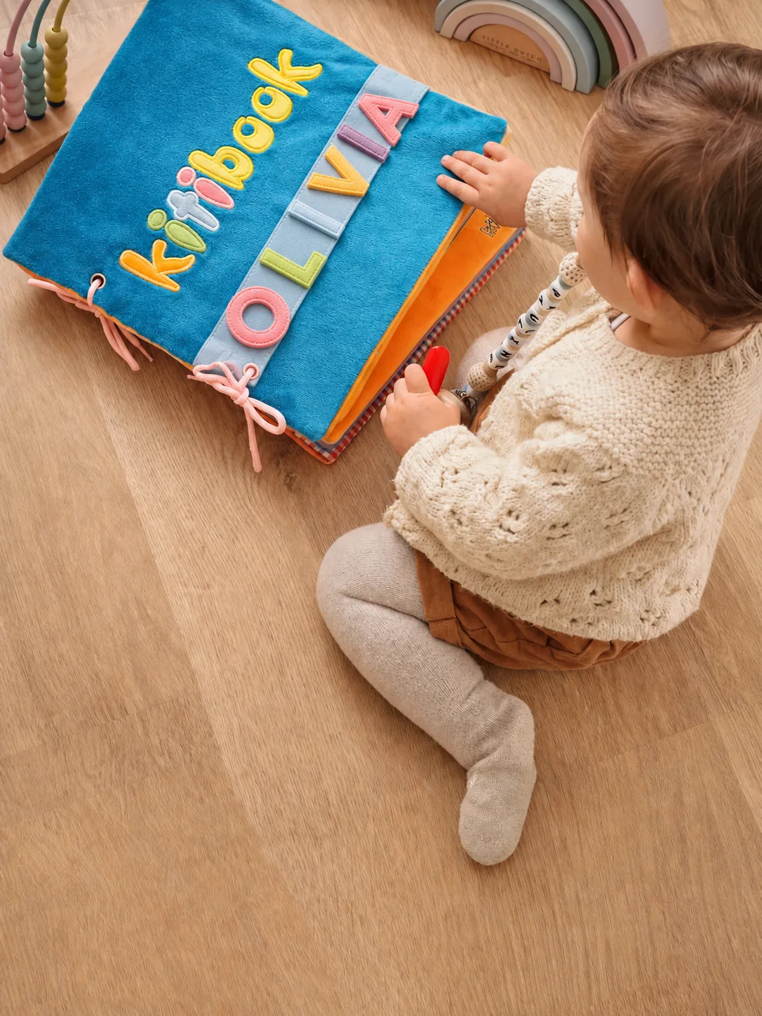 Child playing with their Kitibook — personalized Kitimimi activity book